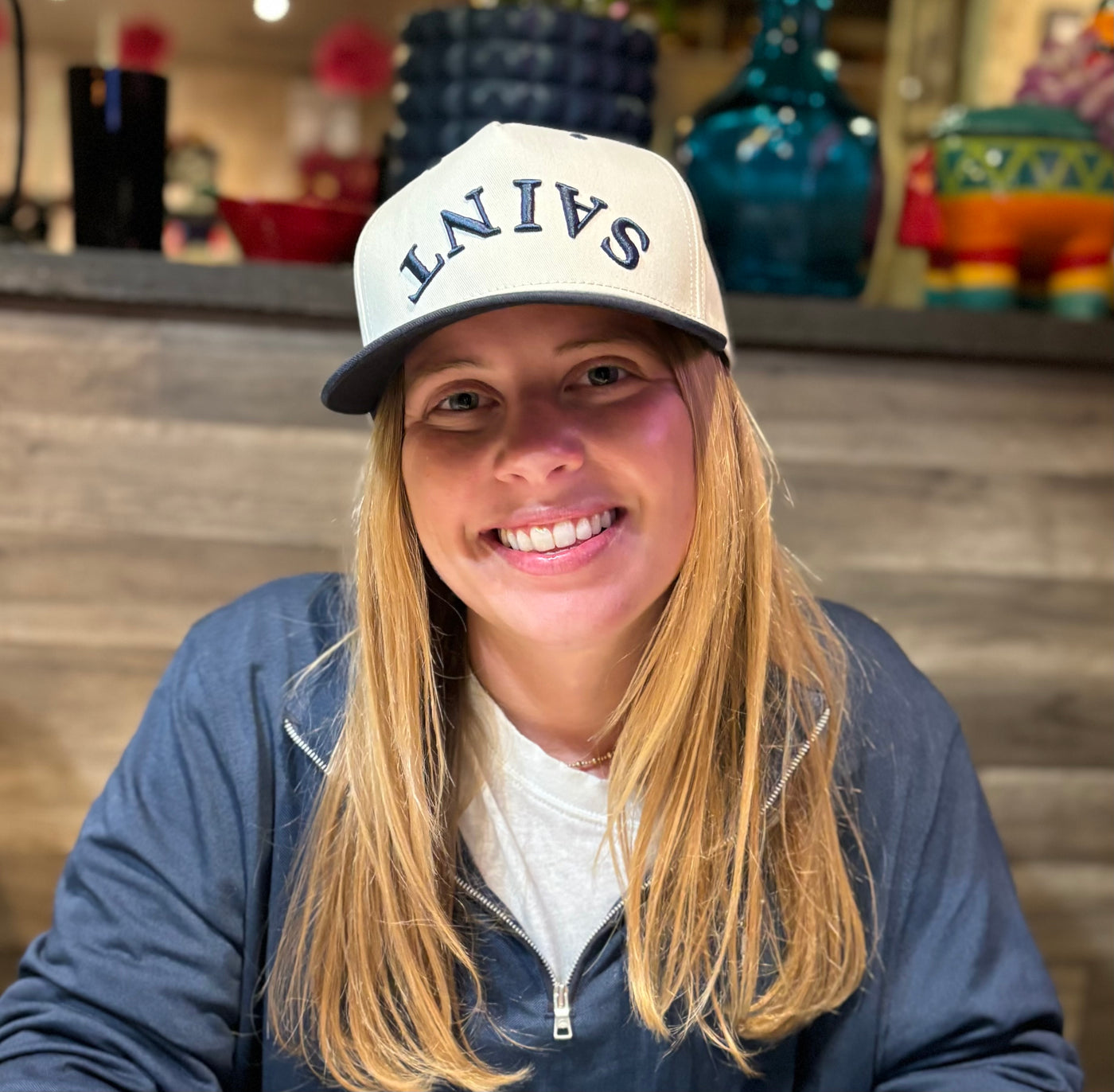 "SAINT" Heritage Cap — Stone Crown with Navy Bill