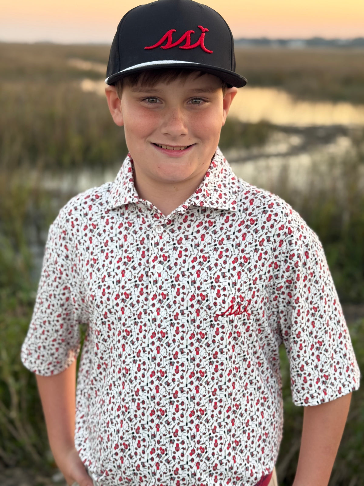 Kids Stretch Performance Polo — Game Day Busy Print