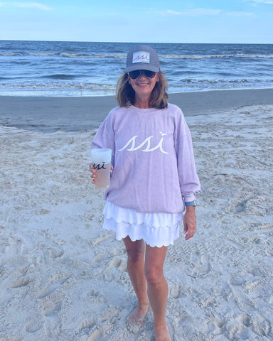 Corded Crew Sweatshirt Lilac color- “Be Where Your Feet Are” on the back.
