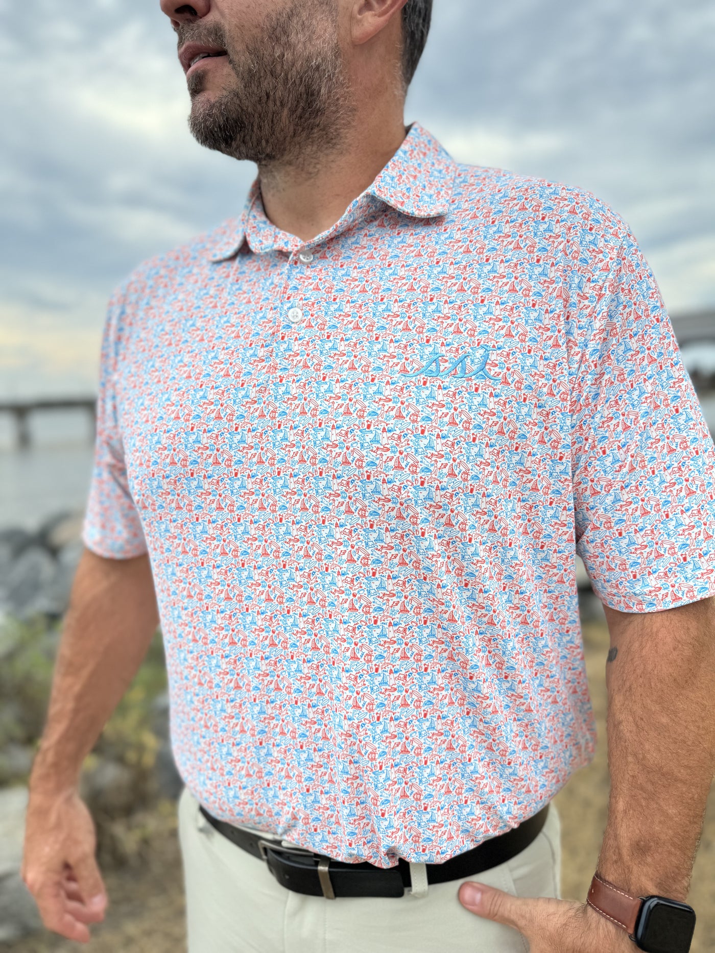 Men's Red and Blue St. Simons Island Icons Allover Print Performance Polo Shirt — Blue SSI Logo