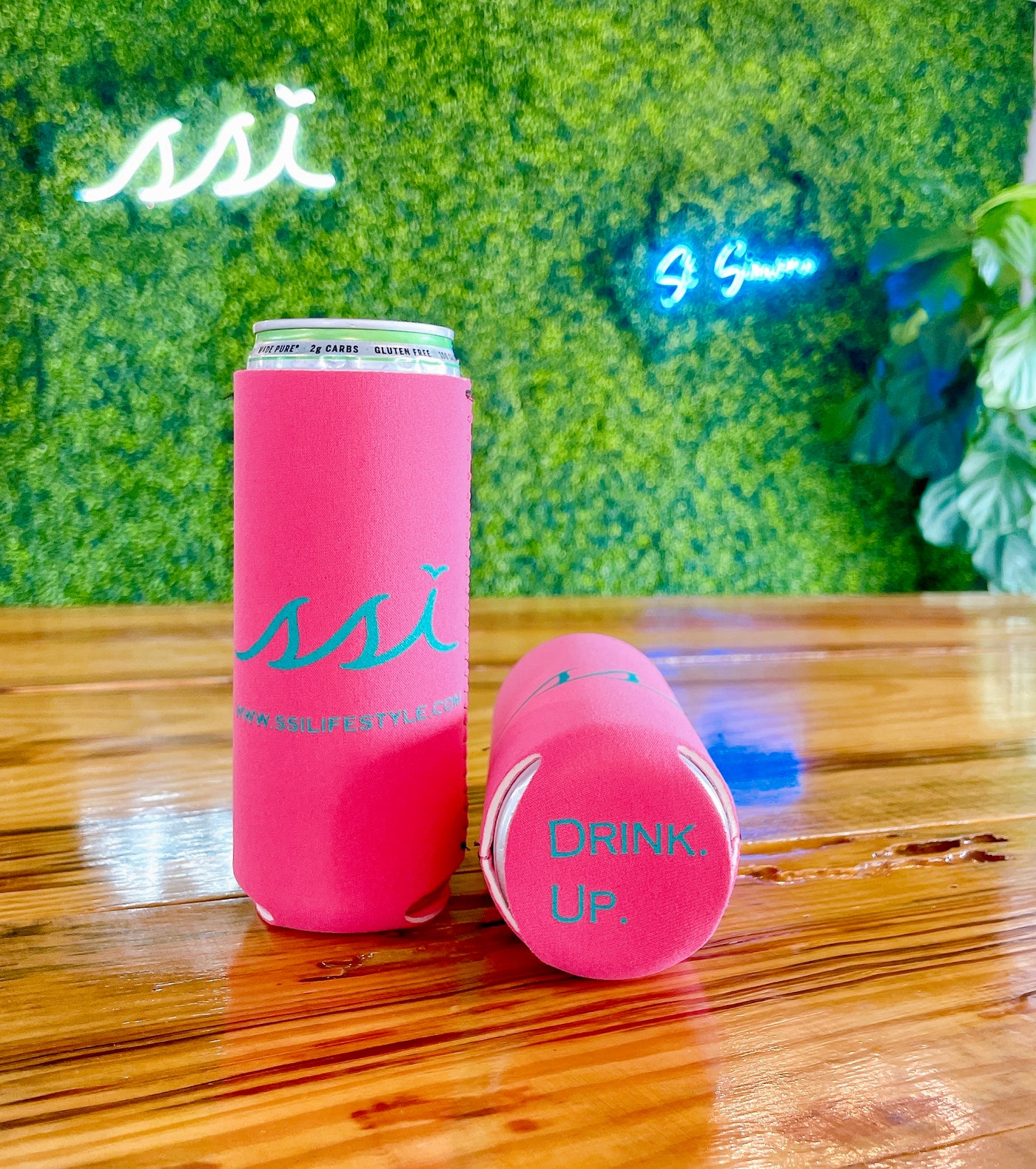 SSI Slim Can Koozie Pink with Green Logo