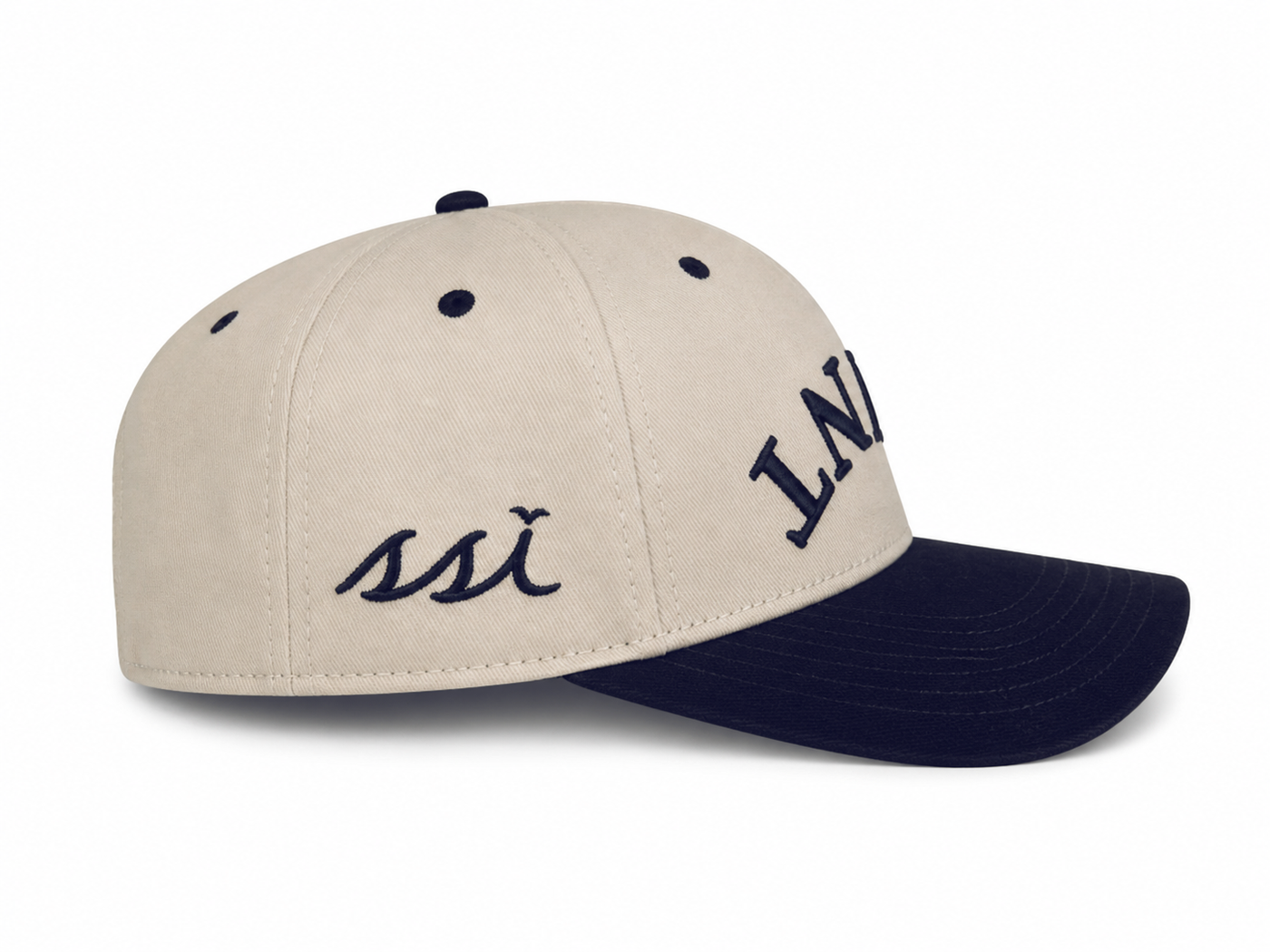 "SAINT" Heritage Cap — Stone Crown with Navy Bill