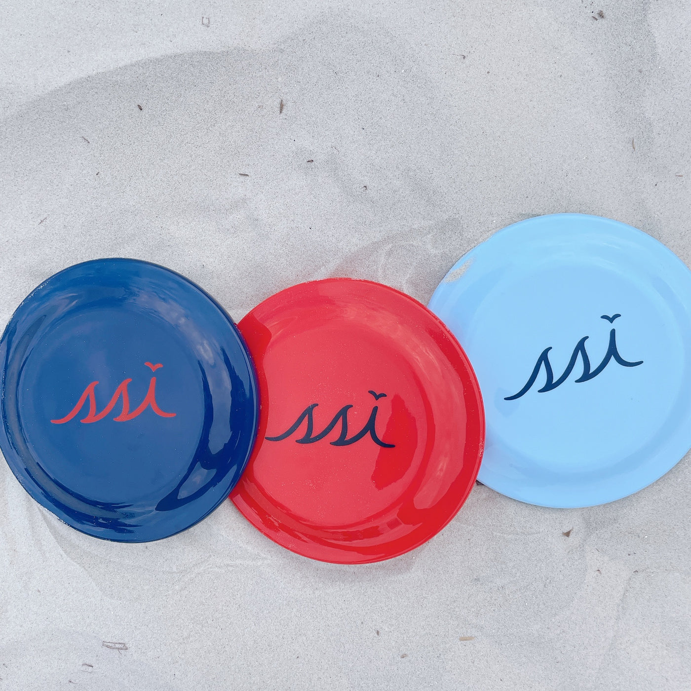 Red Frisbee disk with black logo