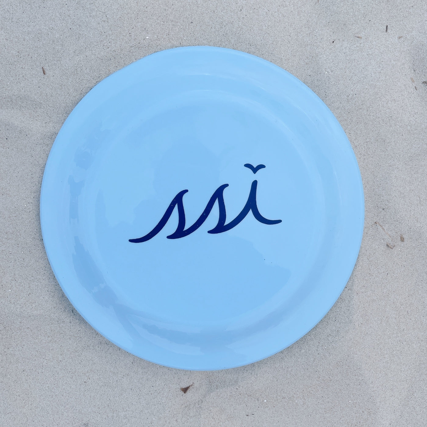 Light Carolina Blue Frisbee disk with navy logo